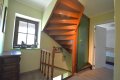 Einseitig angebautes Wohnhaus mit Garage, berdachter Terrasse und Garten