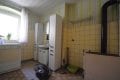 Einseitig angebautes Wohnhaus mit Garten und Garage