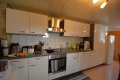 Einseitig angebautes Wohnhaus mit Scheune und Garage