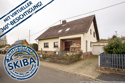 Grozgiges Ein- oder Zweifamilienhaus mit ebenem Garten und Garage in Sierscheid