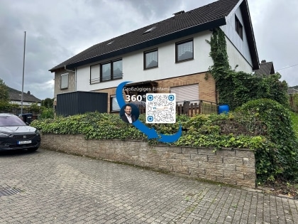 Grozgiges Einfamilienwohnhaus mit vermieteter Einliegerwohnung in toller Aussichtslage