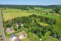 Pferdeliebhaber aufgepasst! Idyllisches Anwesen mit Holzblockhaus, Stallungen, Paddock & Weideland