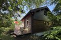 Pferdeliebhaber aufgepasst! Idyllisches Anwesen mit Holzblockhaus, Stallungen, Paddock & Weideland